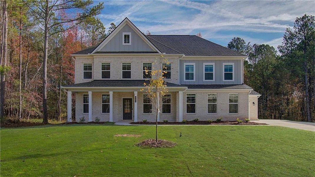 Front exterior of a new home in Trinity Park, McDonough, GA, highlighting curb appeal (Image 18).