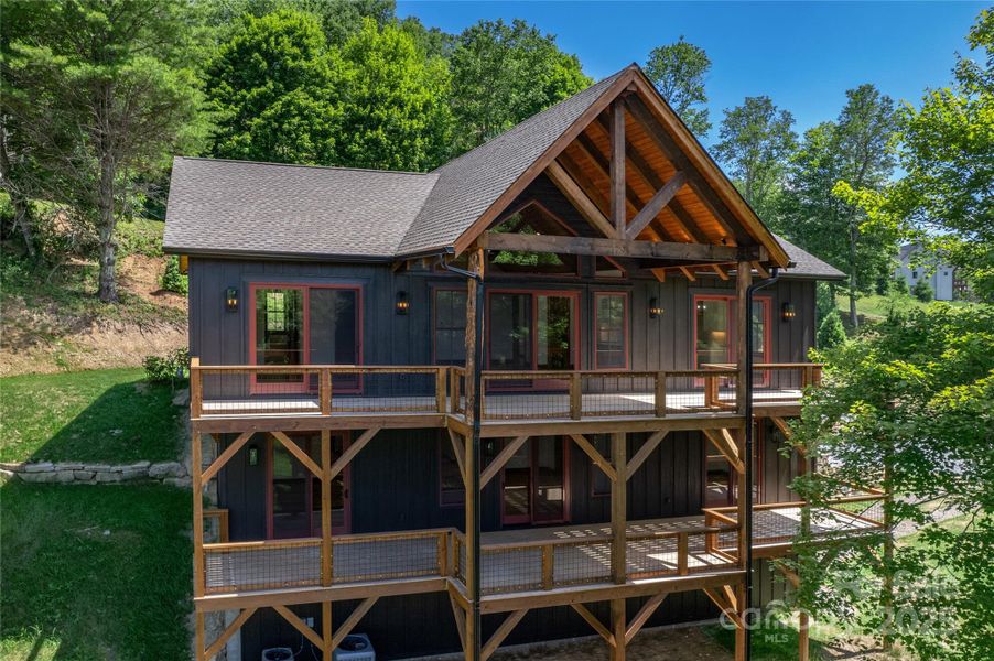 3,178 HLA with 4 bedrooms, 4 full bathrooms, 3 car garage with amble storage, over 1,200 square feet of outdoor space including main level porte-cochere & covered porch with majestic, private mountain & pond views, and main & basement level decks, 2 fireplaces, multiple floor to ceiling sliding glass doors & designer selections throughout.