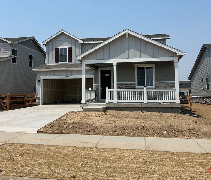 Front exterior of a new home in The Aurora Highlands, Aurora, CO, highlighting curb appeal (Image 1). Front exterior of a new home in The Aurora Highlands, Aurora, CO, highlighting curb appeal (Image 1).