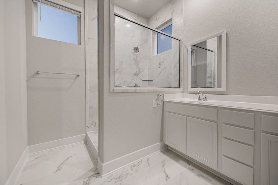 Representative furnished interior of a home built from the Sterling by Chesmar Homes in Stillwater Ranch, Buda (Image 10).