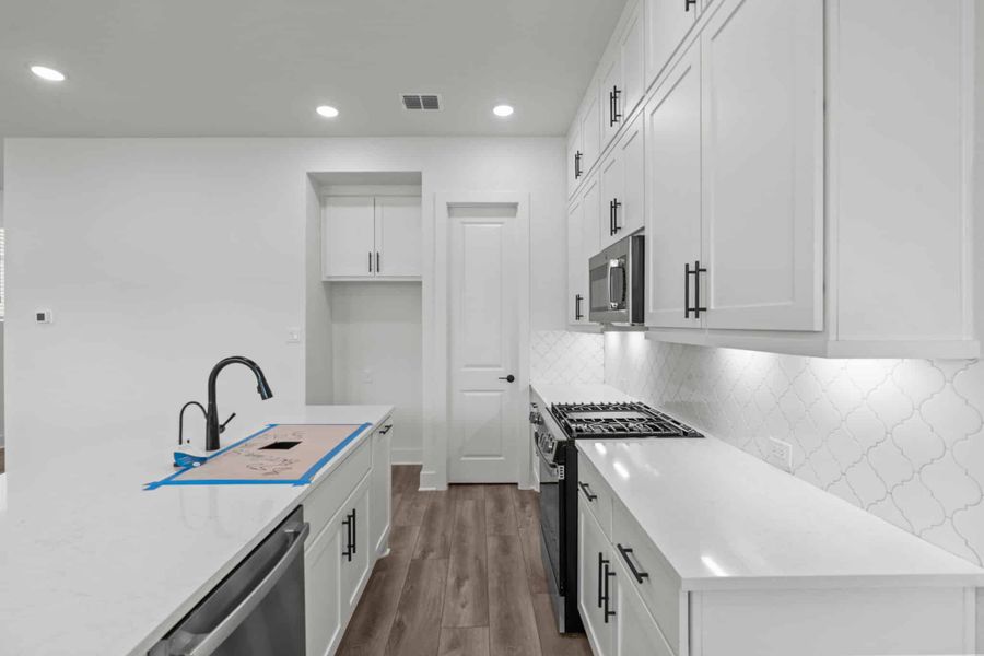 Representative furnished interior of a home built from the Balder by Chesmar Homes in Centero at Stone Oak, San Antonio (Image 4).