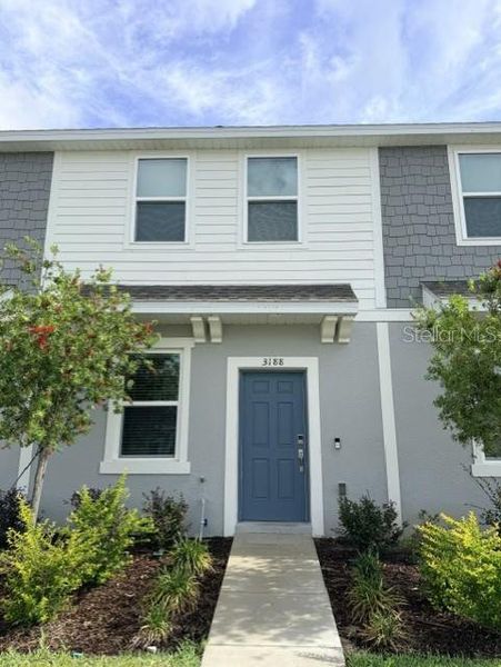 Front exterior of a new home in , Kissimmee, FL, highlighting curb appeal (Image 1). Front exterior of a new home in , Kissimmee, FL, highlighting curb appeal (Image 1).