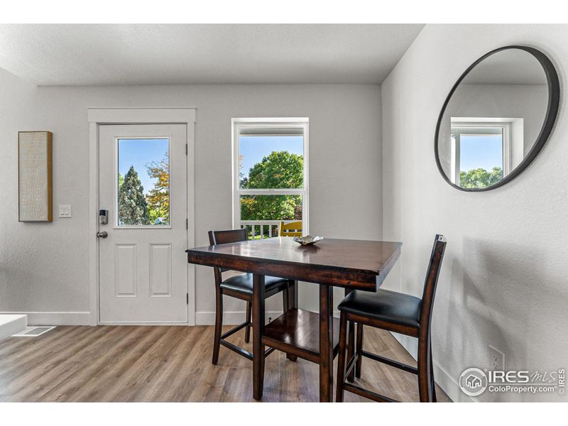 The separate dining area looks out upon the green space.