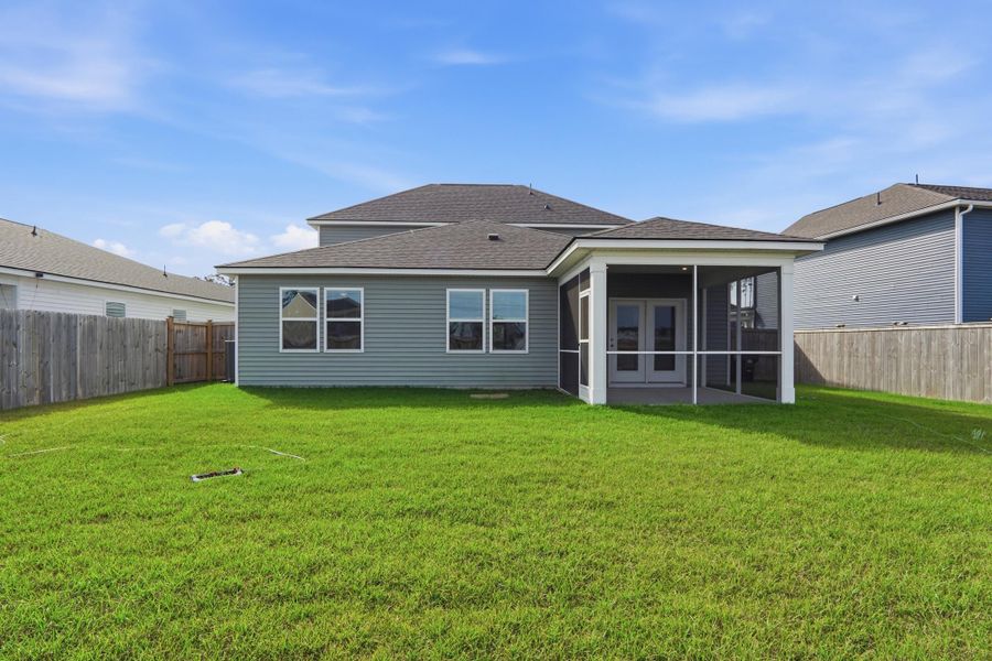 Exterior details and patio area of a home in Sanctuary Cove at Cane Bay, Summerville (Image 27).