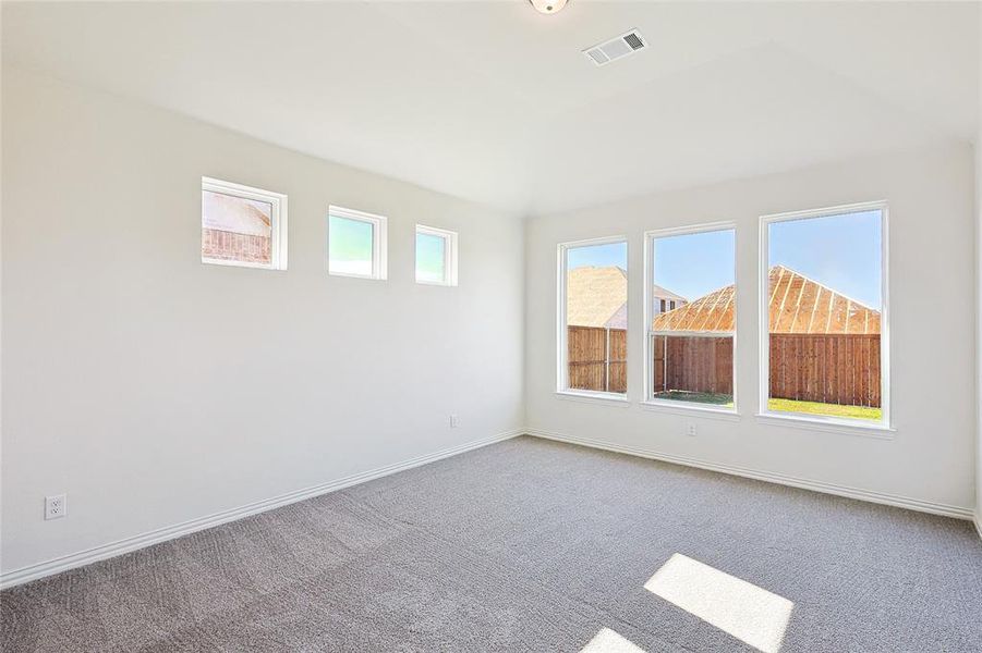 Unfurnished room featuring carpet flooring