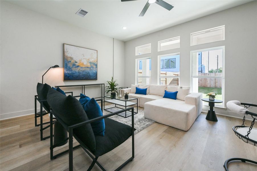 Natural light flows through the first floor from these large windows