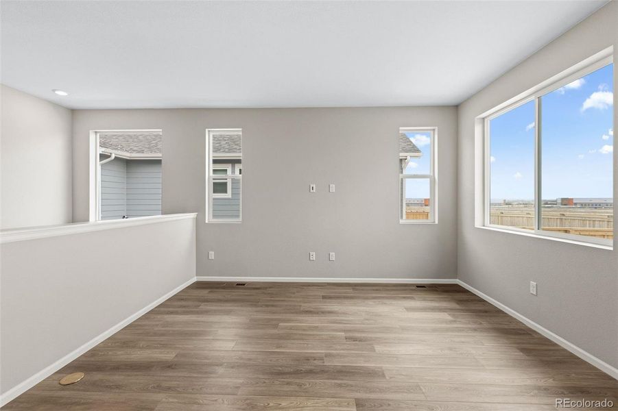 Spacious, unfurnished interior of a new home in The Cottages Collection at Ridgeline Vista, Brighton (Image 11).