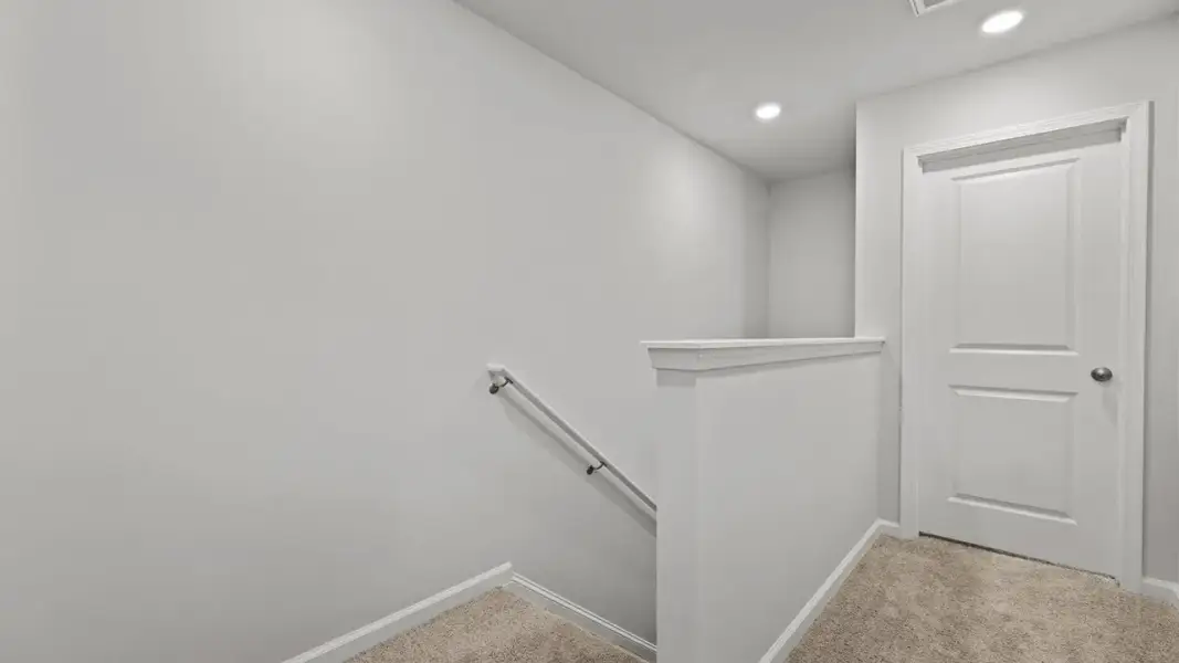 Spacious, unfurnished interior of a new home in Pine Hills Townhomes at Cane Bay, Summerville (Image 14). Spacious, unfurnished interior of a new home in Pine Hills Townhomes at Cane Bay, Summerville (Image 14).