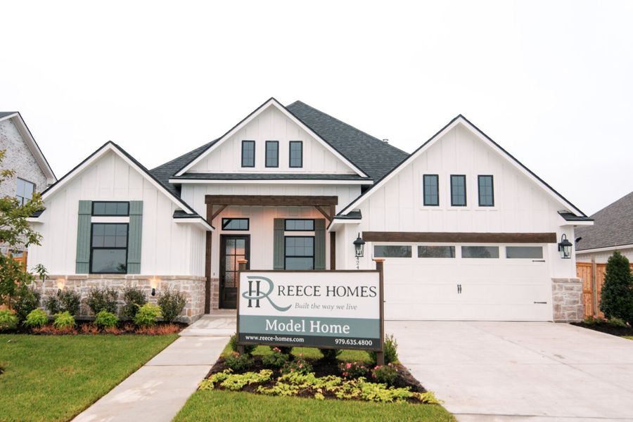 Front exterior of a new home in Oakmont, Bryan, TX, highlighting curb appeal (Image 1).