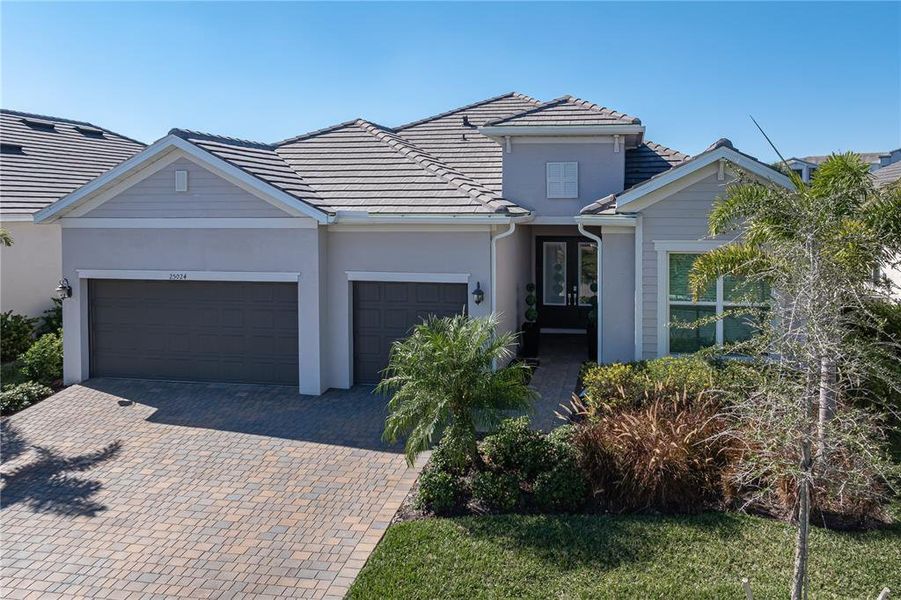 Front exterior of a new home in , Punta Gorda, FL, highlighting curb appeal (Image 27).