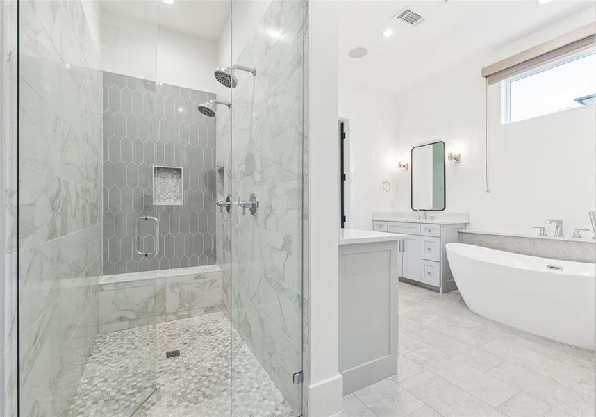 Bathroom with shower with separate bathtub, tile patterned floors, and vanity