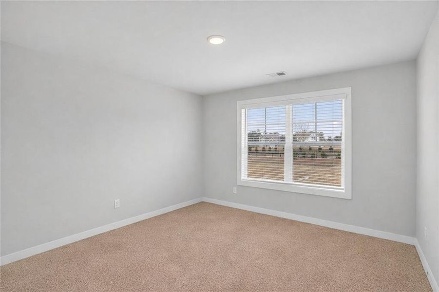 Spacious, unfurnished interior of a new home in The Fairways at Mirror Lake, Villa Rica (Image 24).