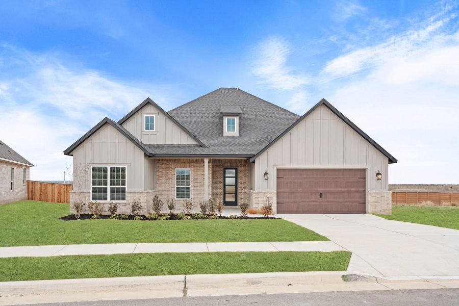 Front exterior of a new home in Colson Ranch, Jarrell, TX, highlighting curb appeal (Image 1). Front exterior of a new home in Colson Ranch, Jarrell, TX, highlighting curb appeal (Image 1).