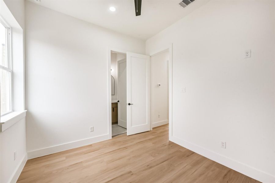 Back view of the bedroom showing the ensuite bathroom.