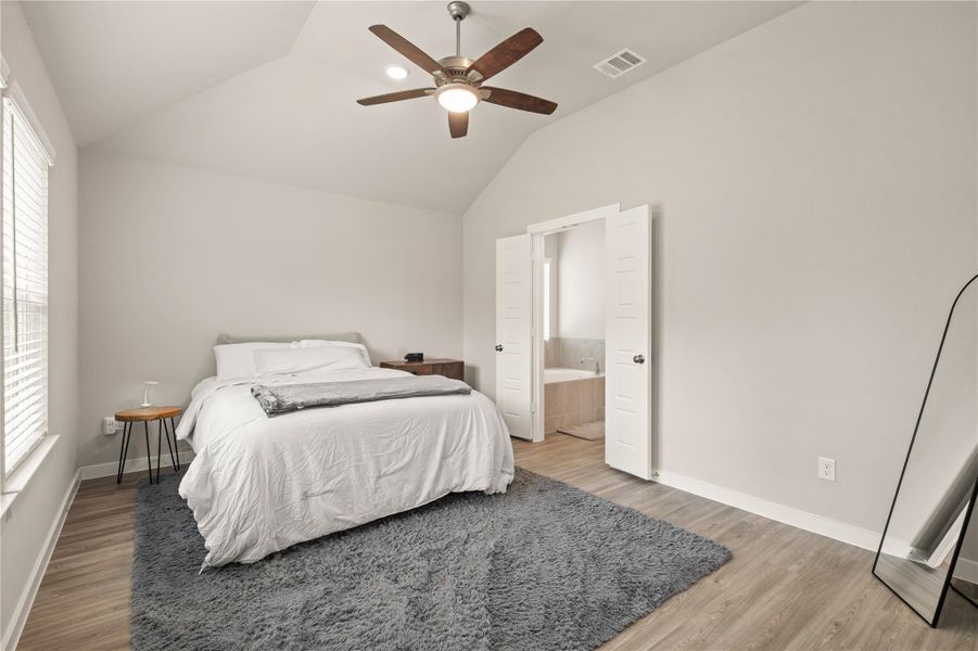 Privately situated at the back of the home, the spacious primary suite offers a peaceful retreat with serene backyard views and no rear neighbors.