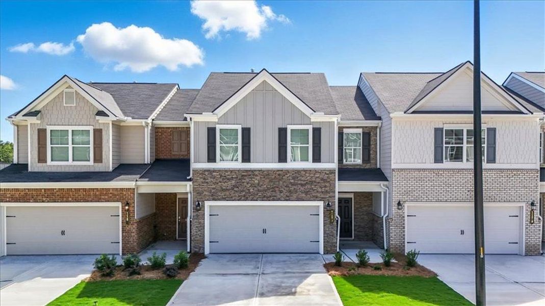 Front exterior of a new home in Park Center Pointe, Austell, GA, highlighting curb appeal (Image 1).