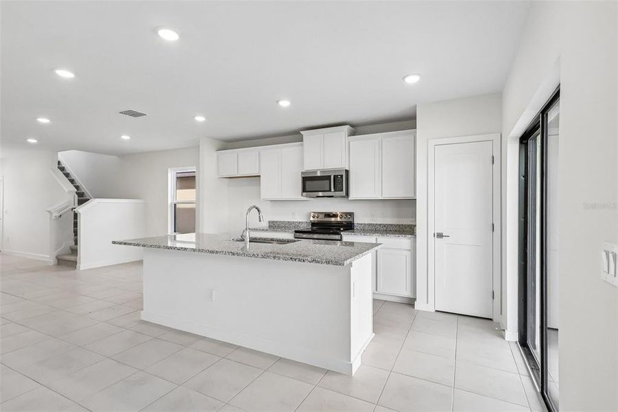 Furnished interior view inside a new home in Grasslands West, Lakeland (Image 13).