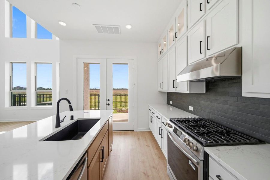 Furnished interior view inside a new home in Bridgeland, Cypress (Image 4).