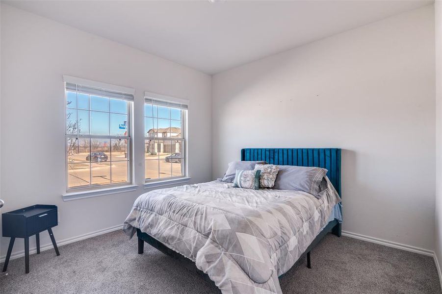 Bedroom with carpet flooring Bedroom with carpet flooring