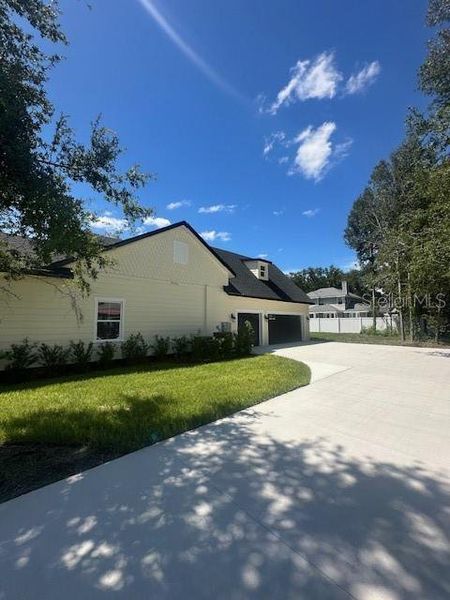 Front exterior of a new home in , Lake Helen, FL, highlighting curb appeal (Image 24).