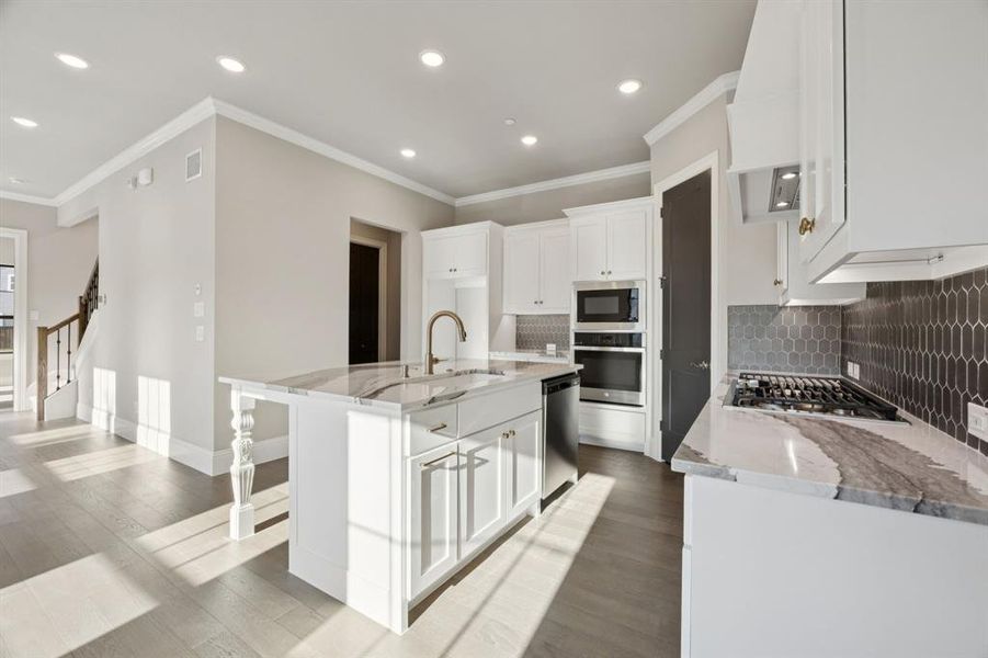 Upgraded countertops with gas cooktop.
