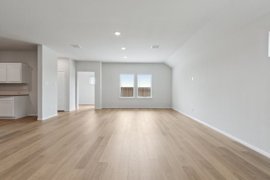 Living & Dining Room in the Hayden home plan by Trophy Signature Homes – REPRESENTATIVE PHOTO