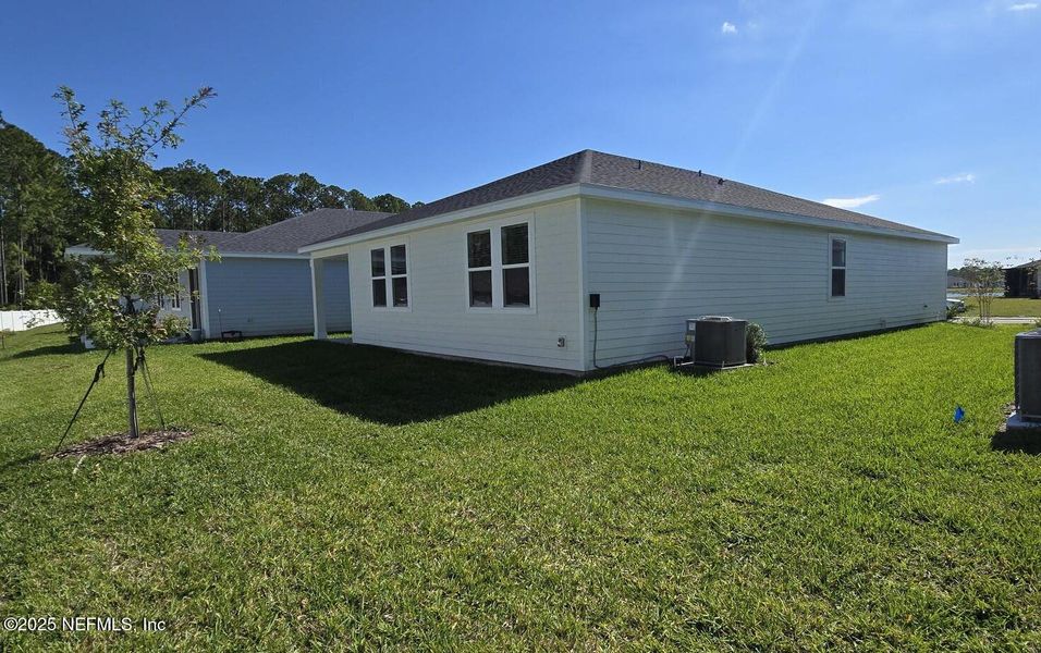 Exterior details and patio area of a home in Flagler Village - Signature Series, Palm Coast (Image 5).