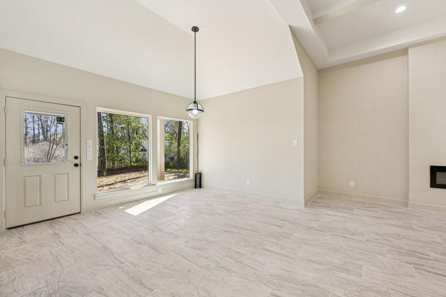 Bright and spacious Dining area with large windows offering plenty of natural light and views of the outdoors.