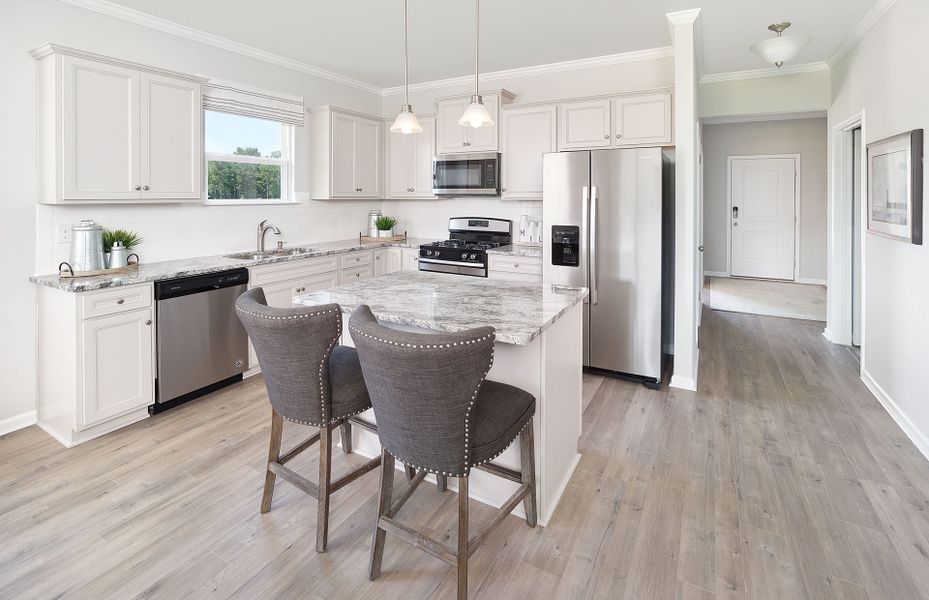 Open Kitchen with white cabinets and granite count