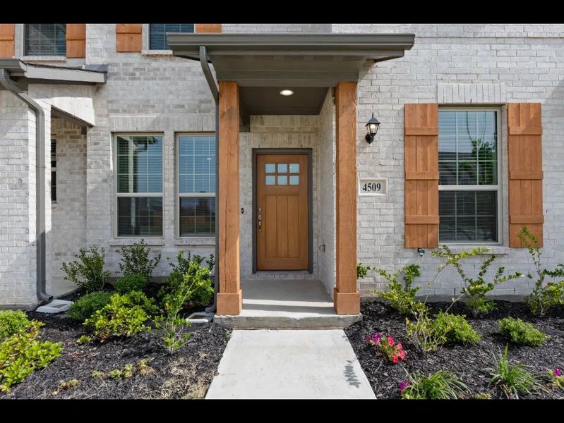 Front exterior of a new home in Sanger Circle, Sanger, TX, highlighting curb appeal (Image 5).