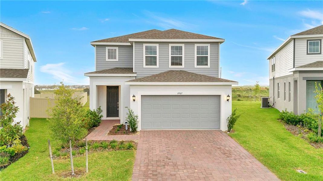 Front exterior of a new home in , Clermont, FL, highlighting curb appeal (Image 1). Front exterior of a new home in , Clermont, FL, highlighting curb appeal (Image 1).