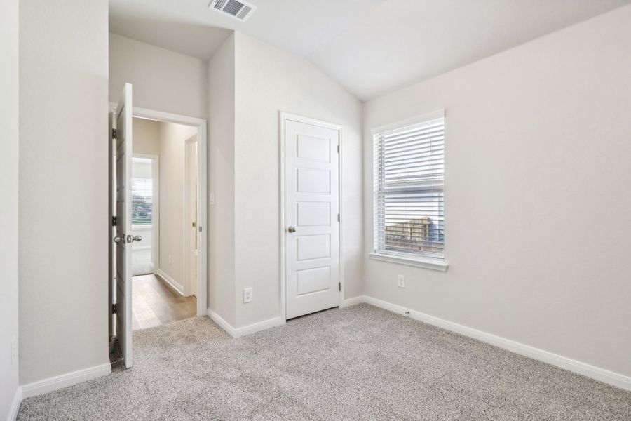 Guest bedroom in the Briscoe floorplan at a Meritage Homes community.