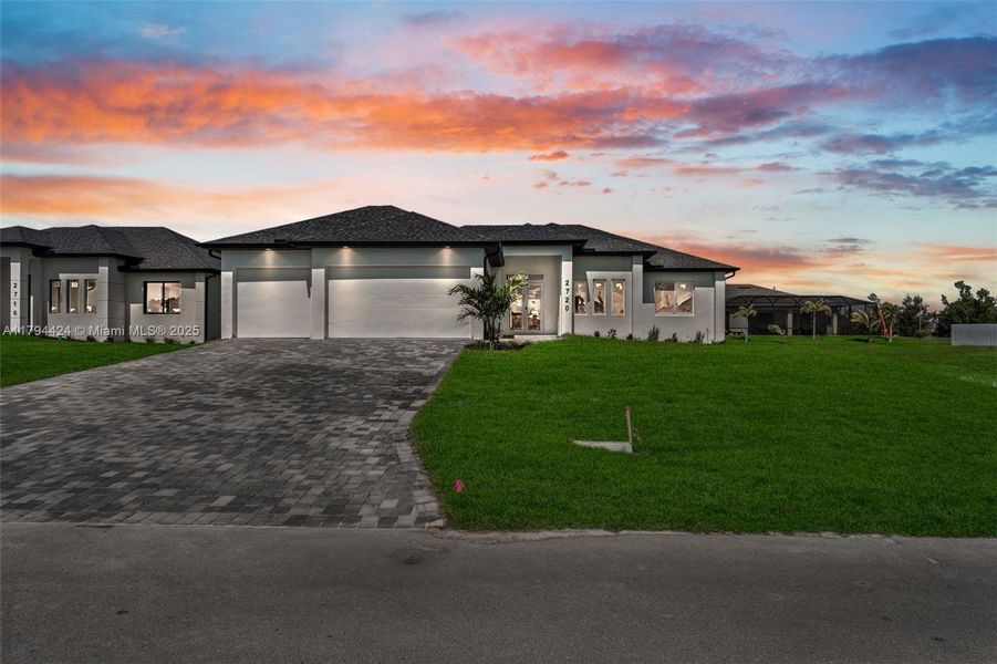 Front exterior of a new home in , Cape Coral, FL, highlighting curb appeal (Image 23). Front exterior of a new home in , Cape Coral, FL, highlighting curb appeal (Image 23).