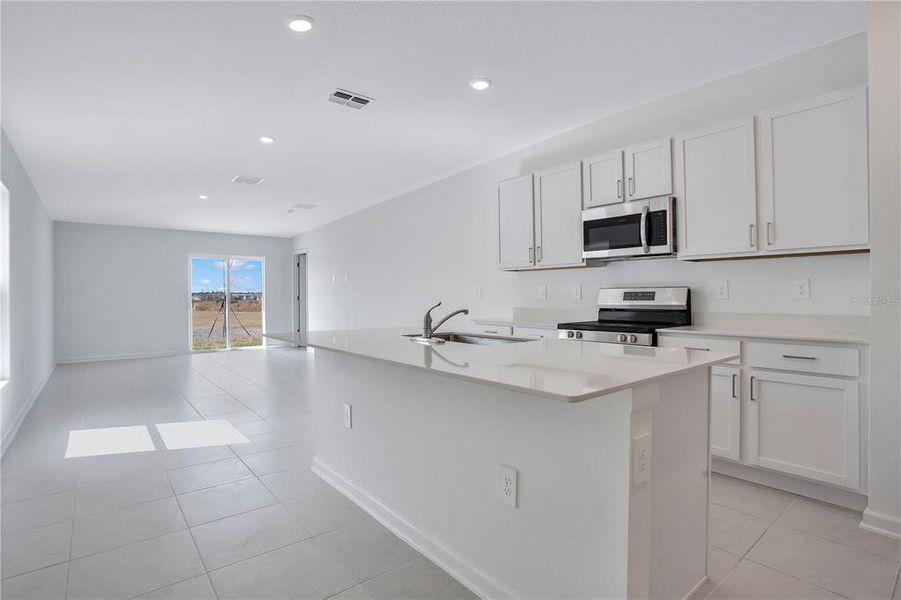 Furnished interior view inside a new home in Peace Creek Reserve, Winter Haven (Image 5).