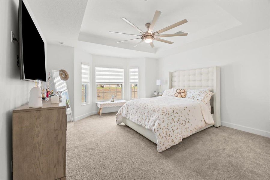 Spacious Master Bedroom with Picturesque Bay Window and Natural Light