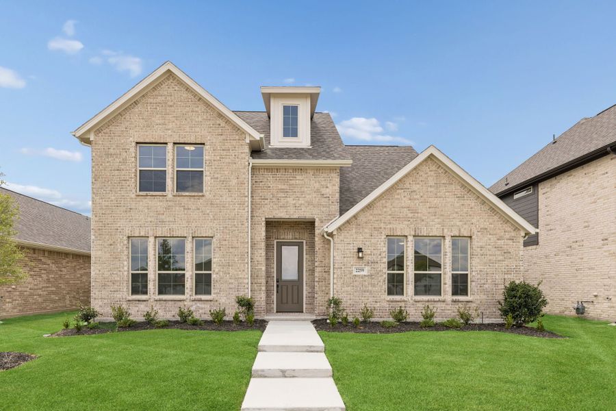 Front exterior of a new home in Dove Hollow, Waxahachie, TX, highlighting curb appeal (Image 2). Front exterior of a new home in Dove Hollow, Waxahachie, TX, highlighting curb appeal (Image 2).