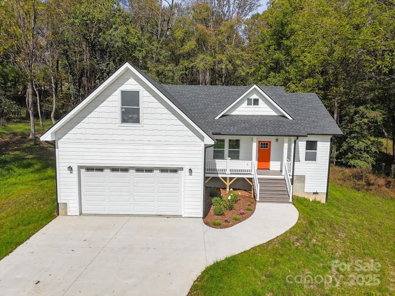 Front exterior of a new home in , Candler, NC, highlighting curb appeal (Image 2). Front exterior of a new home in , Candler, NC, highlighting curb appeal (Image 2).