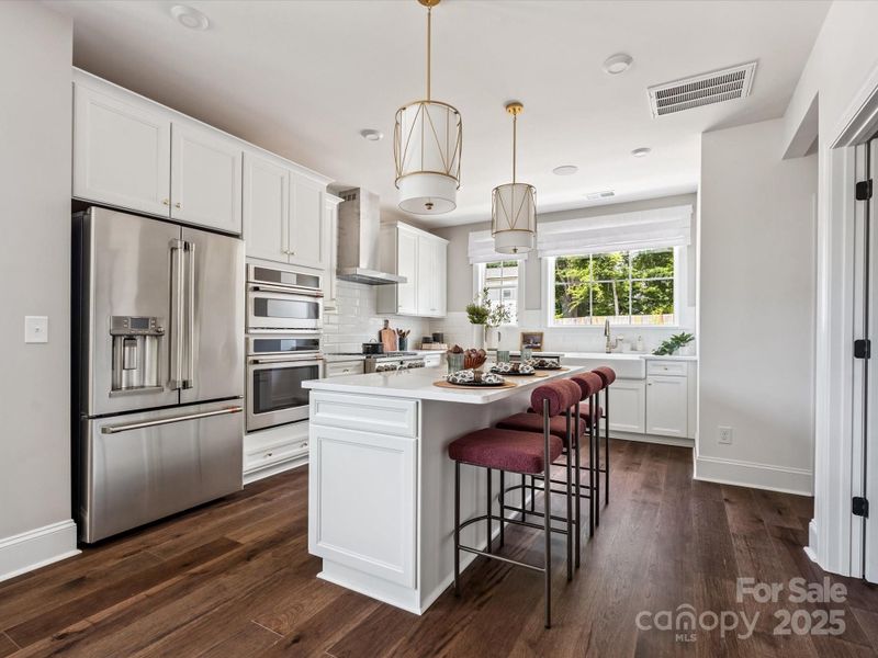 Bright Open Gourmet Kitchen With Designer Selected Pendant Lighting *Model Photos | Actual orientation, structural selections, and finishes may vary. Bright Open Gourmet Kitchen With Designer Selected Pendant Lighting *Model Photos | Actual orientation, structural selections, and finishes may vary.