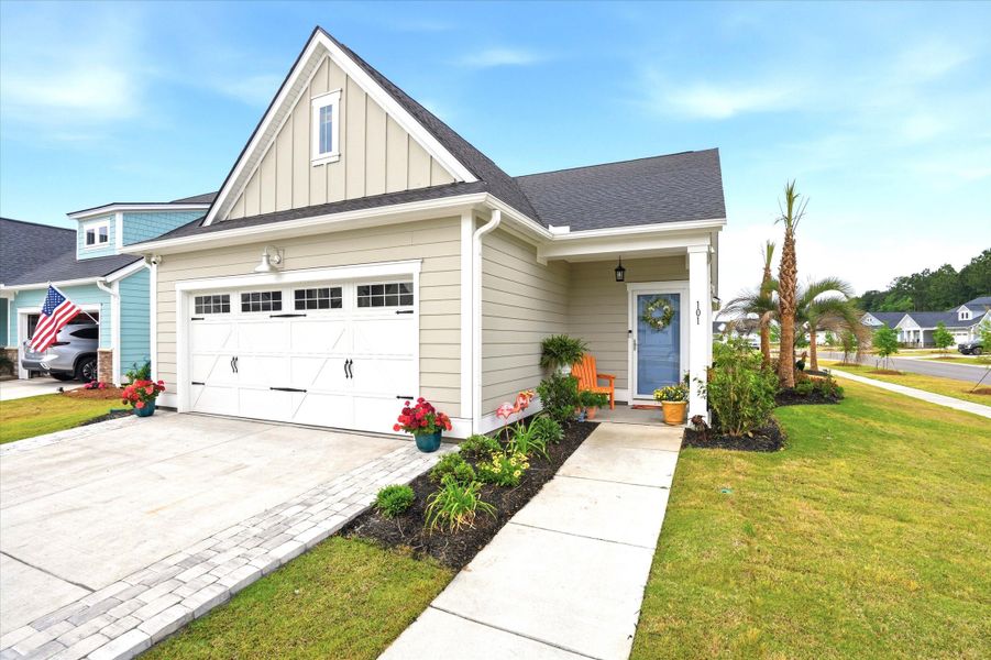 Front exterior of a new home in Horizons at Carnes Crossroads | 55+, Summerville, SC, highlighting curb appeal (Image 2).