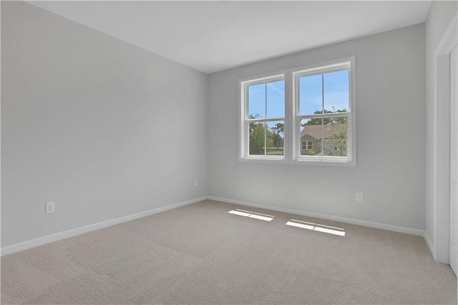 Spacious, unfurnished interior of a new home in The Paddocks at Doc Hughes, Buford (Image 38).