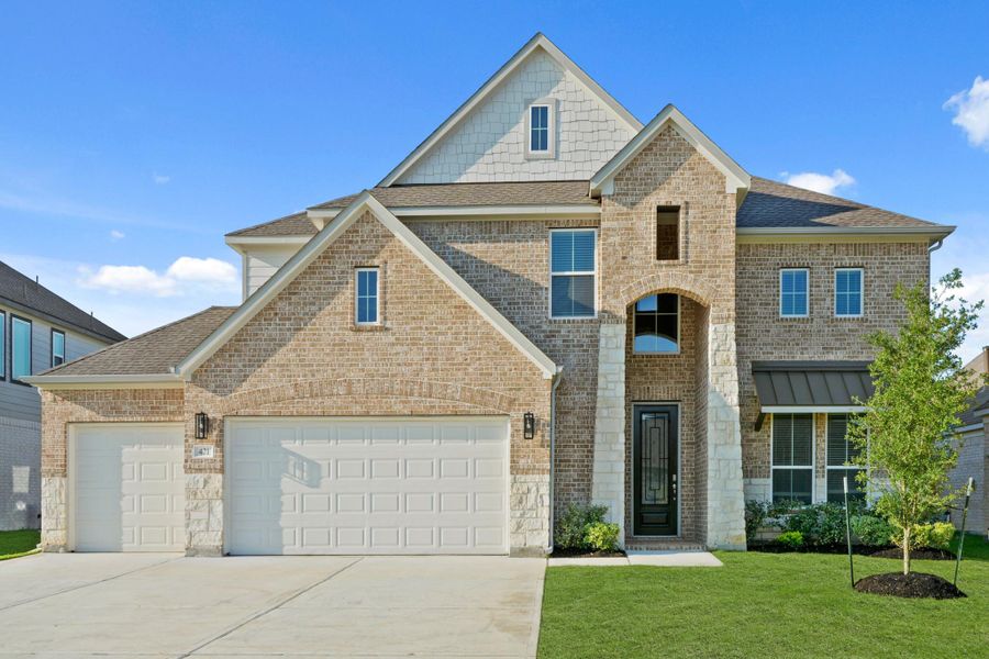 Front exterior of a new home in Beacon Hill, Waller, TX, highlighting curb appeal (Image 13). Front exterior of a new home in Beacon Hill, Waller, TX, highlighting curb appeal (Image 13).