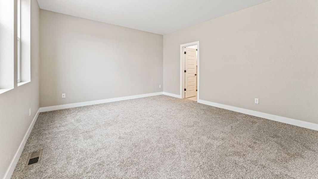 Representative unfurnished interior of a home built from the Pike by Taylor Morrison in The Aurora Highlands Town Collection, Aurora (Image 24).
