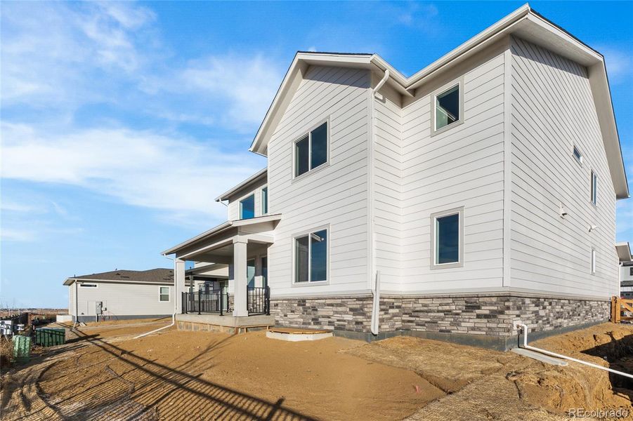 Exterior details and patio area of a home in Harvest Crossing, Aurora (Image 4).