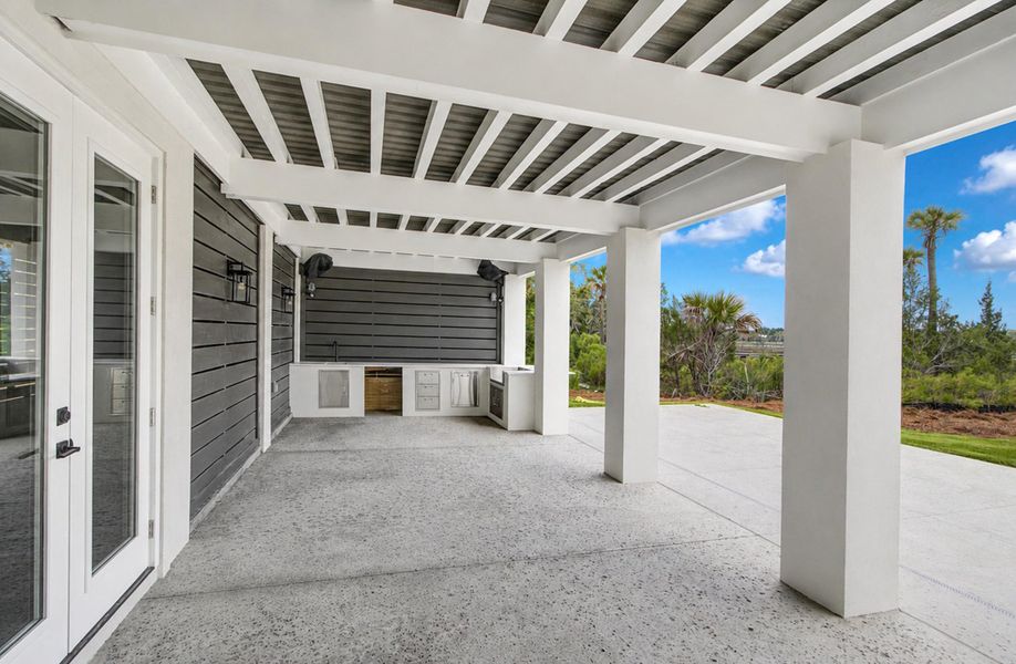 Exterior details and patio area of a home in , Awendaw (Image 17).
