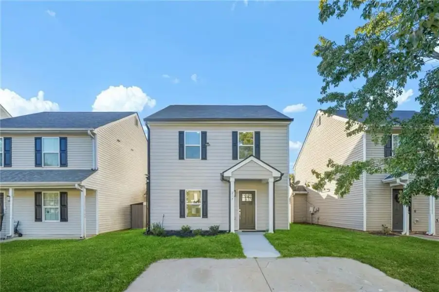 Front exterior of a new home in , Stockbridge, GA, highlighting curb appeal (Image 1). Front exterior of a new home in , Stockbridge, GA, highlighting curb appeal (Image 1).