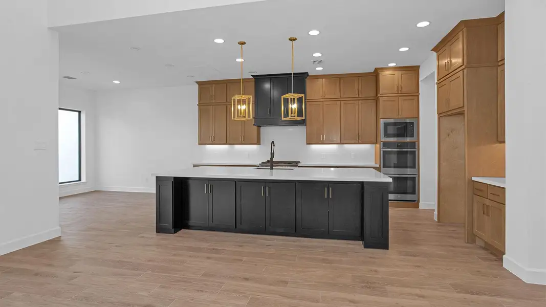 Furnished interior view inside a new home in Sienna 65' - Valencia, Missouri City (Image 3).