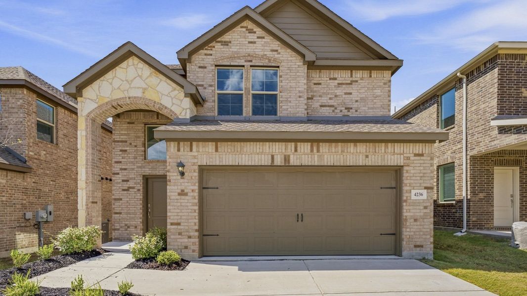 Front exterior of a new home in Bel Air Village, Sherman, TX, highlighting curb appeal (Image 1). Front exterior of a new home in Bel Air Village, Sherman, TX, highlighting curb appeal (Image 1).
