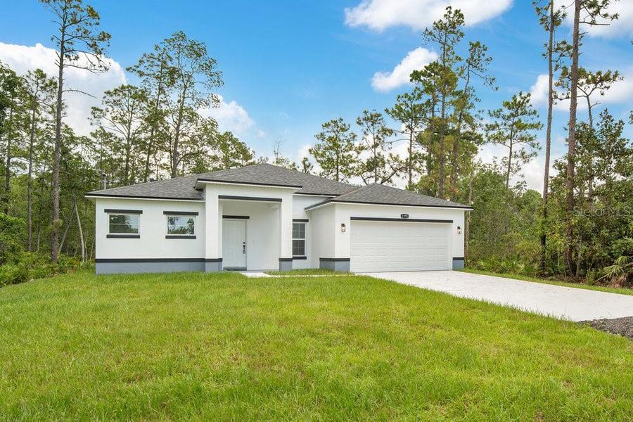 Front exterior of a new home in , Deland, FL, highlighting curb appeal (Image 15). Front exterior of a new home in , Deland, FL, highlighting curb appeal (Image 15).