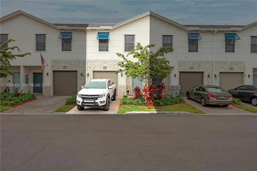 Front exterior of a new home in , Pompano Beach, FL, highlighting curb appeal (Image 1). Front exterior of a new home in , Pompano Beach, FL, highlighting curb appeal (Image 1).