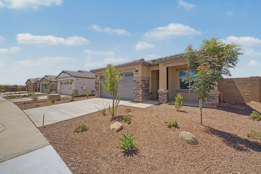 Front exterior of a new home in Avanti at Granite Vista, Waddell, AZ, highlighting curb appeal (Image 2). Front exterior of a new home in Avanti at Granite Vista, Waddell, AZ, highlighting curb appeal (Image 2).